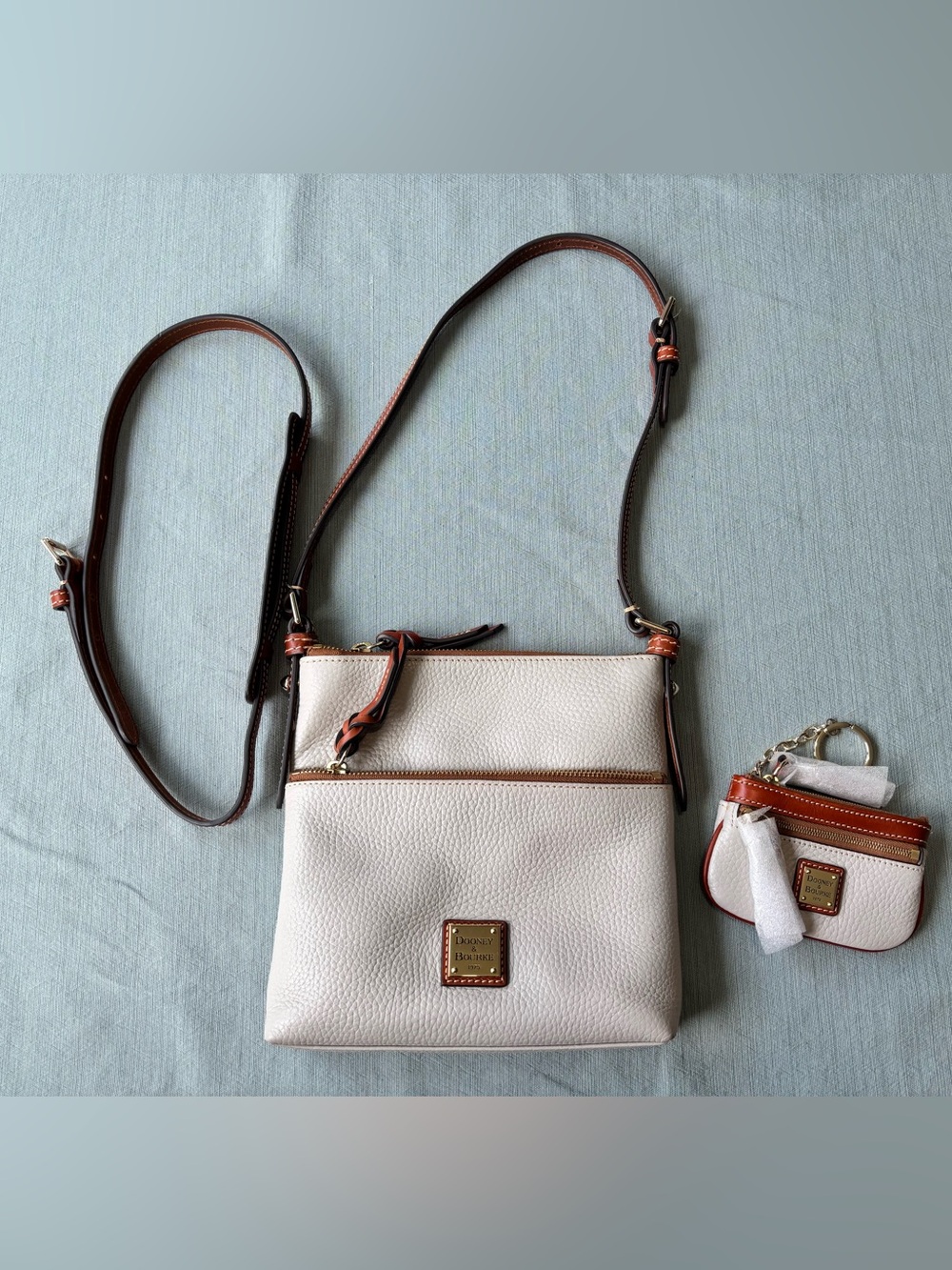 Dooney & Bourke Cream Pebble Leather Crossbody with Brown Trim and coin purse